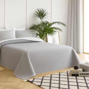 luxury quilted silver grey bedspread. Soft, lightweight, perfect blend of comfort and style for all seasons.